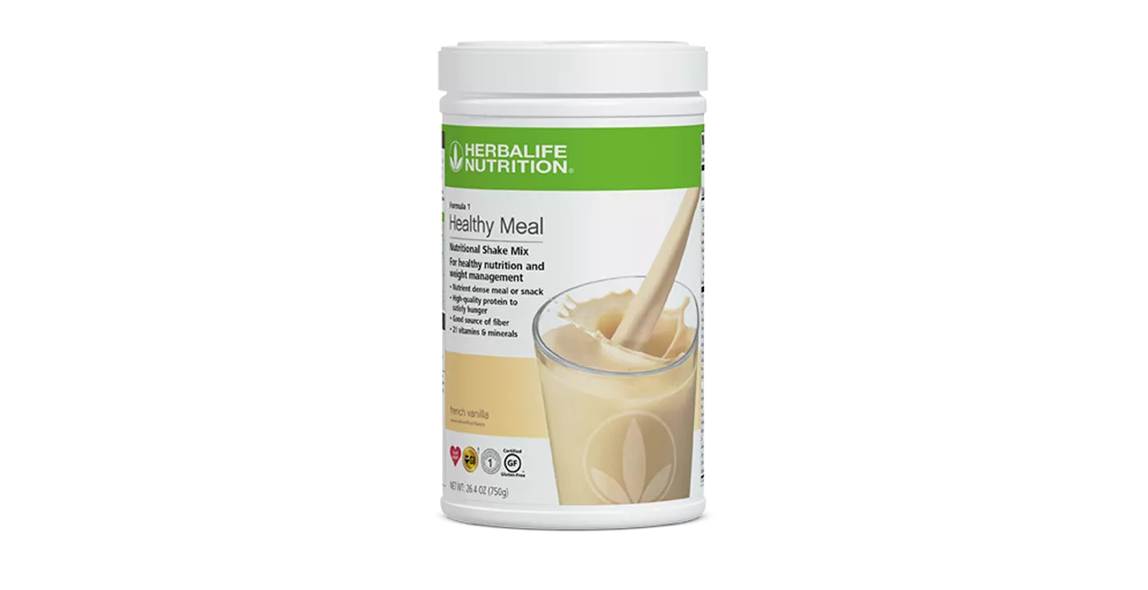 Herbalife Formula 1 French Vanilla shake mix on a wooden kitchen counter